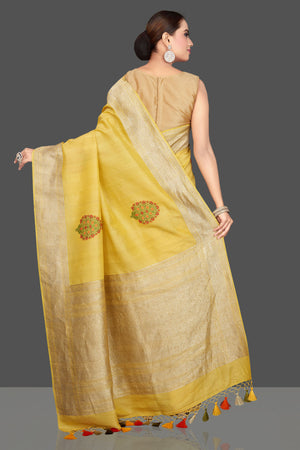 Buy stunning light yellow tussar georgette sari online in USA with tree weave buta and zari border. Look gorgeous on special occasions with exquisite Indian sarees, handwoven sarees, Banarasi sarees, pure silk sarees from Pure Elegance Indian saree store in USA.-back