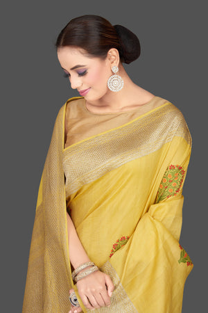 Buy stunning light yellow tussar georgette sari online in USA with tree weave buta and zari border. Look gorgeous on special occasions with exquisite Indian sarees, handwoven sarees, Banarasi sarees, pure silk sarees from Pure Elegance Indian saree store in USA.-closeup