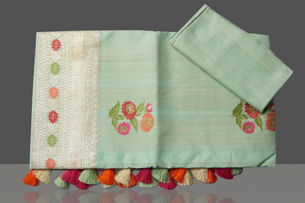 Shop beautiful mint green tussar georgette saree online in USA with floral weave buta and silver zari border. Look gorgeous on special occasions with exquisite Indian sarees, handwoven sarees, Banarasi sarees, pure silk sarees from Pure Elegance Indian saree store in USA.-blouse
