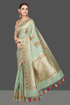 Shop beautiful mint green tussar georgette saree online in USA with floral weave buta and silver zari border. Look gorgeous on special occasions with exquisite Indian sarees, handwoven sarees, Banarasi sarees, pure silk sarees from Pure Elegance Indian saree store in USA.-full view