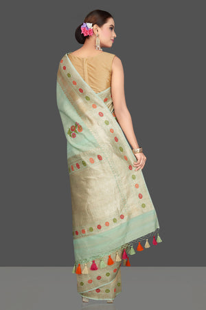 Shop beautiful mint green tussar georgette saree online in USA with floral weave buta and silver zari border. Look gorgeous on special occasions with exquisite Indian sarees, handwoven sarees, Banarasi sarees, pure silk sarees from Pure Elegance Indian saree store in USA.-back