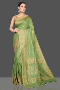 Shop beautiful pista green tussar georgette saree online in USA with golden zari border. Look gorgeous on special occasions with exquisite Indian sarees, handwoven sarees, Banarasi sarees, pure silk sarees from Pure Elegance Indian saree store in USA.-full view