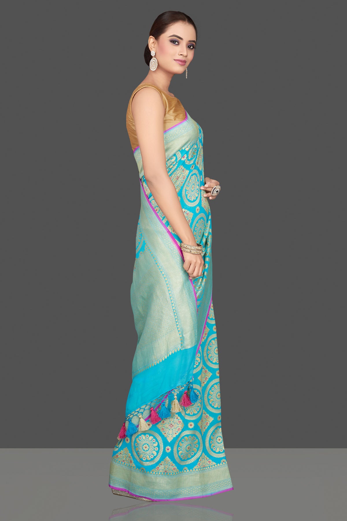 Buy stunning turquoise blue Katan silk sari online in USA with overall zari wprk. Look gorgeous on special occasions with exquisite Indian sarees, handwoven sarees, Banarasi sarees, pure silk sarees from Pure Elegance Indian saree store in USA.-side