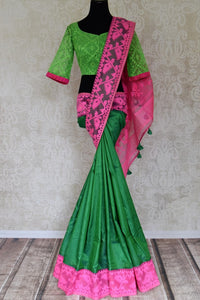 Shop stunning green raw silk sari online in USA with pink Jamdani border and saree blouse. Shop beautiful handwoven saris, chanderi sarees, Maheshwari sarees, pure silk sarees, Banarasi sarees online in USA from Pure Elegance Indian fashion store.-full view