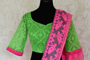 Shop stunning green raw silk sari online in USA with pink Jamdani border and saree blouse. Shop beautiful handwoven saris, chanderi sarees, Maheshwari sarees, pure silk sarees, Banarasi sarees online in USA from Pure Elegance Indian fashion store.-blouse pallu