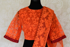 Shop beautiful red raw silk sari online in USA with orange Jamdani border and saree blouse. Shop beautiful handwoven saris, chanderi sarees, Maheshwari sarees, pure silk sarees, Banarasi sarees online in USA from Pure Elegance Indian fashion store.-blouse pallu