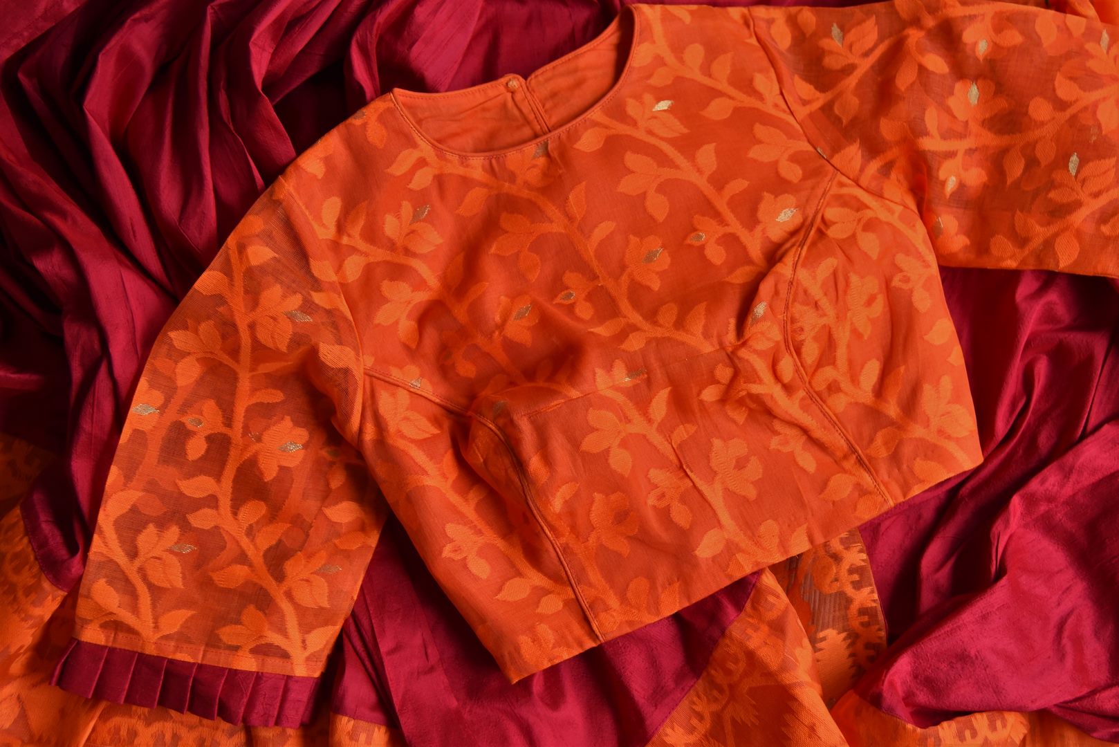 Shop beautiful red raw silk sari online in USA with orange Jamdani border and saree blouse. Shop beautiful handwoven saris, chanderi sarees, Maheshwari sarees, pure silk sarees, Banarasi sarees online in USA from Pure Elegance Indian fashion store.-details