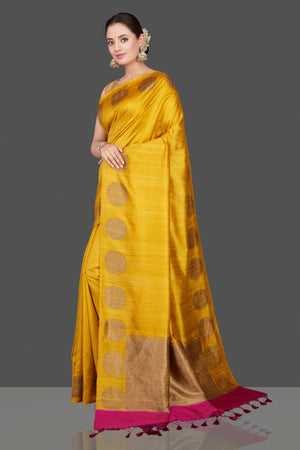 Shop gorgeous yellow tussar Banarasi saree online in USA with zari buta border. Go for stunning Indian designer sarees, georgette sarees, handwoven saris, embroidered sarees for festive occasions and weddings from Pure Elegance Indian clothing store in USA.-pallu