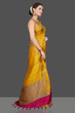 Shop gorgeous yellow tussar Banarasi saree online in USA with zari buta border. Go for stunning Indian designer sarees, georgette sarees, handwoven saris, embroidered sarees for festive occasions and weddings from Pure Elegance Indian clothing store in USA.-right