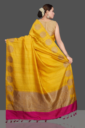 Shop gorgeous yellow tussar Banarasi saree online in USA with zari buta border. Go for stunning Indian designer sarees, georgette sarees, handwoven saris, embroidered sarees for festive occasions and weddings from Pure Elegance Indian clothing store in USA.-back