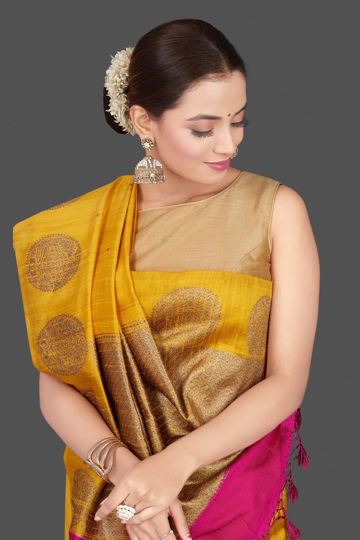 Shop gorgeous yellow tussar Banarasi saree online in USA with zari buta border. Go for stunning Indian designer sarees, georgette sarees, handwoven saris, embroidered sarees for festive occasions and weddings from Pure Elegance Indian clothing store in USA.-closeup