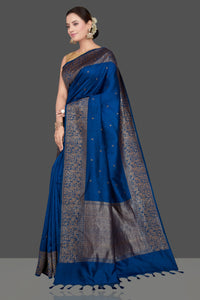 Buy stunning dark blue tussar Banarasi saree online in USA with antique zari buta border. Go for stunning Indian designer sarees, georgette sarees, handwoven saris, embroidered sarees for festive occasions and weddings from Pure Elegance Indian clothing store in USA.-full view