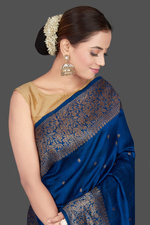 Buy stunning dark blue tussar Banarasi saree online in USA with antique zari buta border. Go for stunning Indian designer sarees, georgette sarees, handwoven saris, embroidered sarees for festive occasions and weddings from Pure Elegance Indian clothing store in USA.-closeup