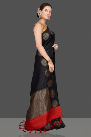 Buy ravishing black tussar Benarasi saree online in USA with antique zari buta border. Go for stunning Indian designer sarees, georgette sarees, handwoven saris, embroidered sarees for festive occasions and weddings from Pure Elegance Indian clothing store in USA.-side