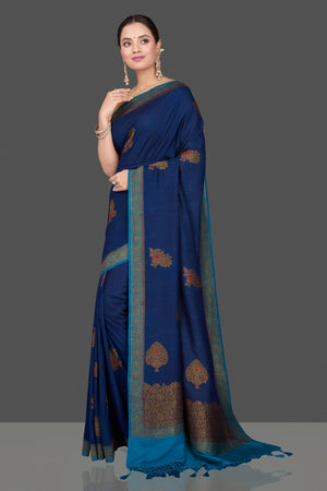 Buy beautiful dark blue Muga Banarasi sari online in USA with light blue antique zari border. Get ready for festive occasions and weddings in tasteful designer sarees, Banarasi sarees, handwoven sarees from Pure Elegance Indian clothing store in USA.-side