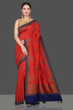 Shop beautiful red Muga Banarasi saree online in USA with blue antique zari border. Get ready for festive occasions and weddings in tasteful designer sarees, Banarasi sarees, handwoven sarees from Pure Elegance Indian clothing store in USA.-front