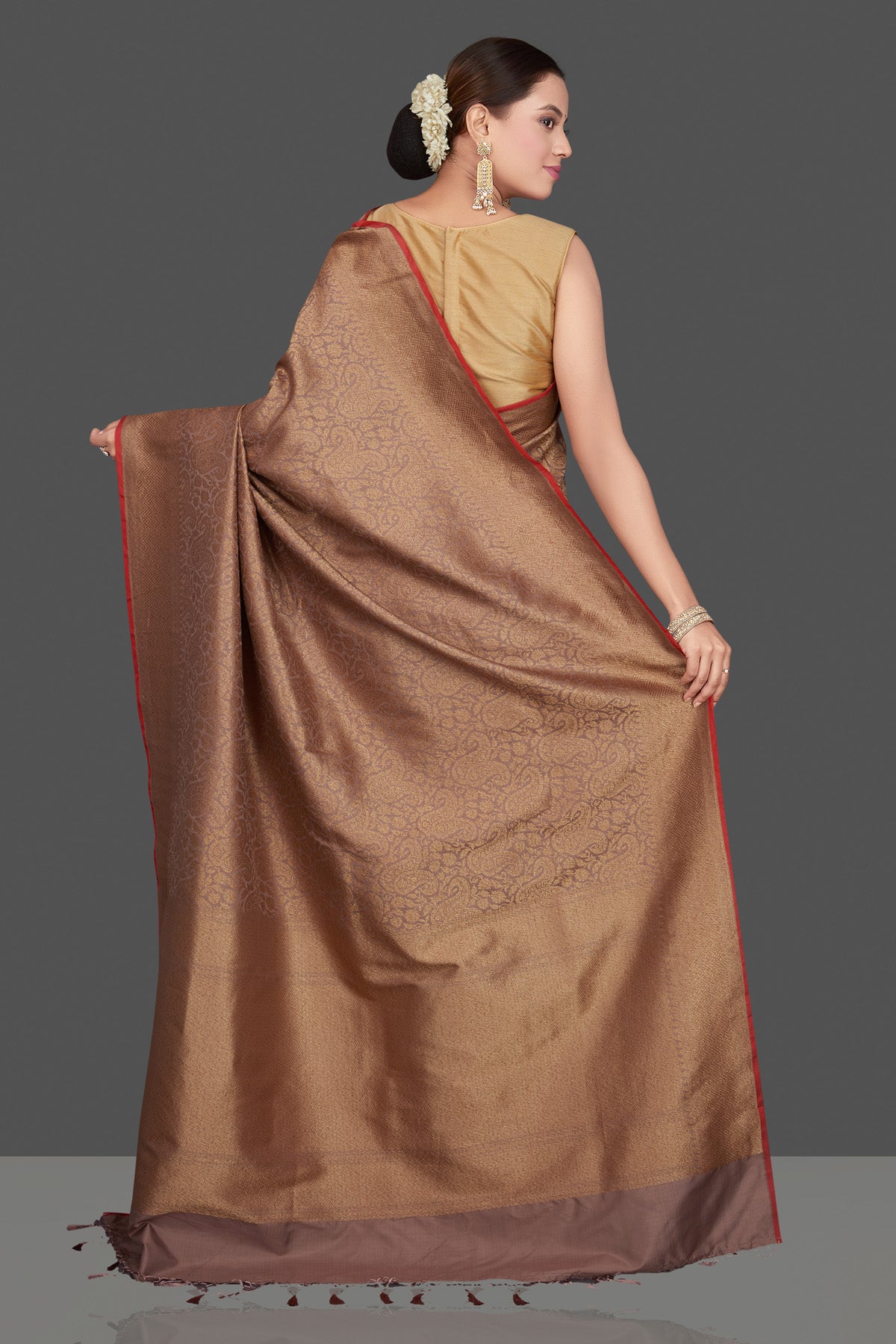 Shop beautiful beige tussar Banarasi saree online in USA with golden zari work. Get ready for festive occasions and weddings in tasteful designer sarees, Banarasi sarees, handwoven sarees from Pure Elegance Indian clothing store in USA.-back
