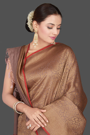 Shop beautiful beige tussar Banarasi saree online in USA with golden zari work. Get ready for festive occasions and weddings in tasteful designer sarees, Banarasi sarees, handwoven sarees from Pure Elegance Indian clothing store in USA.-closeup
