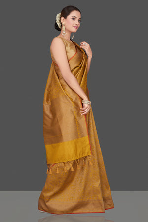 Buy gorgeous mustard tussar Banarasi sari online in USA with golden zari work. Get ready for festive occasions and weddings in tasteful designer saris, Banarasi sarees, handwoven sarees from Pure Elegance Indian clothing store in USA.-right
