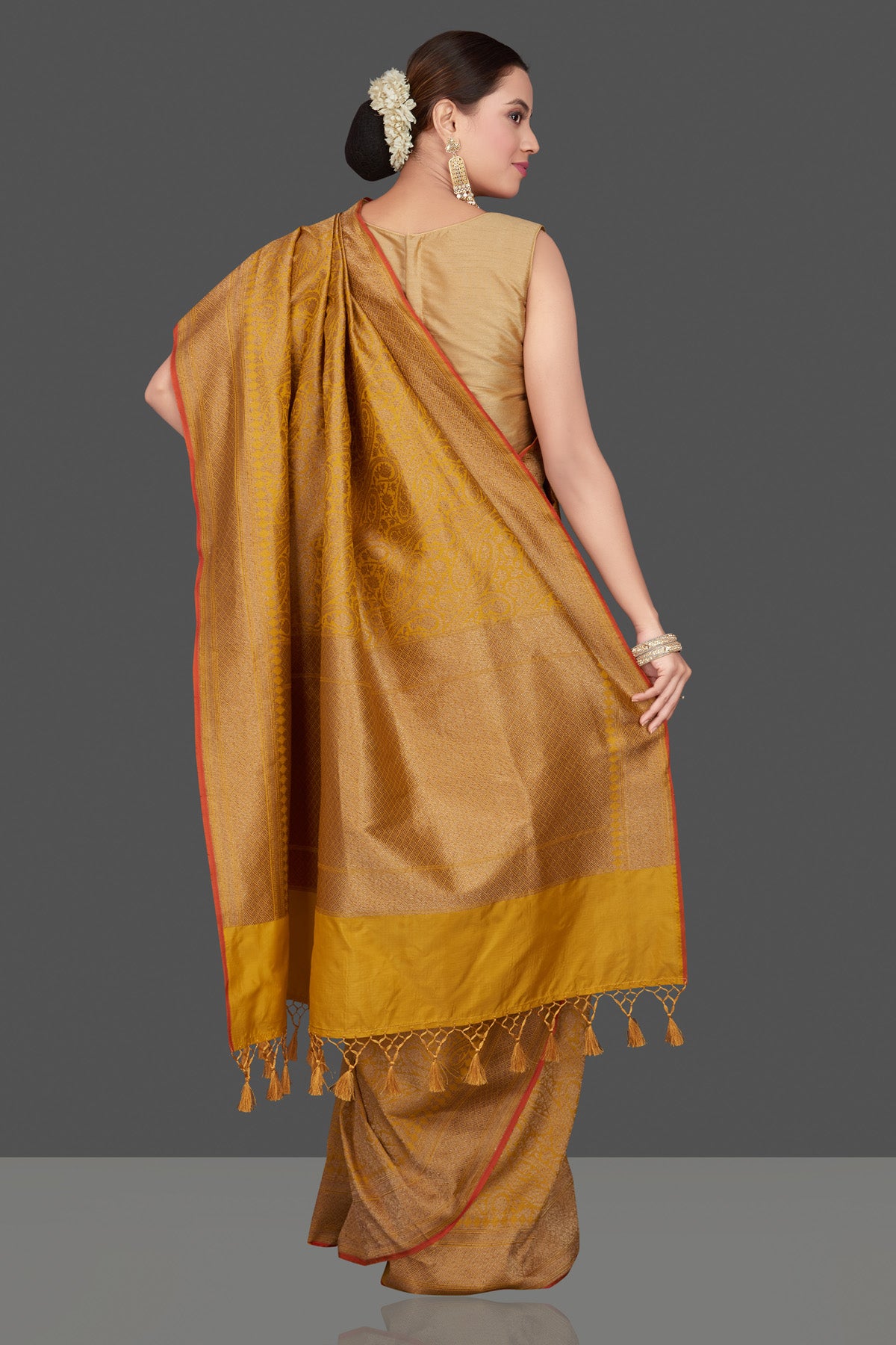 Buy gorgeous mustard tussar Banarasi sari online in USA with golden zari work. Get ready for festive occasions and weddings in tasteful designer saris, Banarasi sarees, handwoven sarees from Pure Elegance Indian clothing store in USA.-back