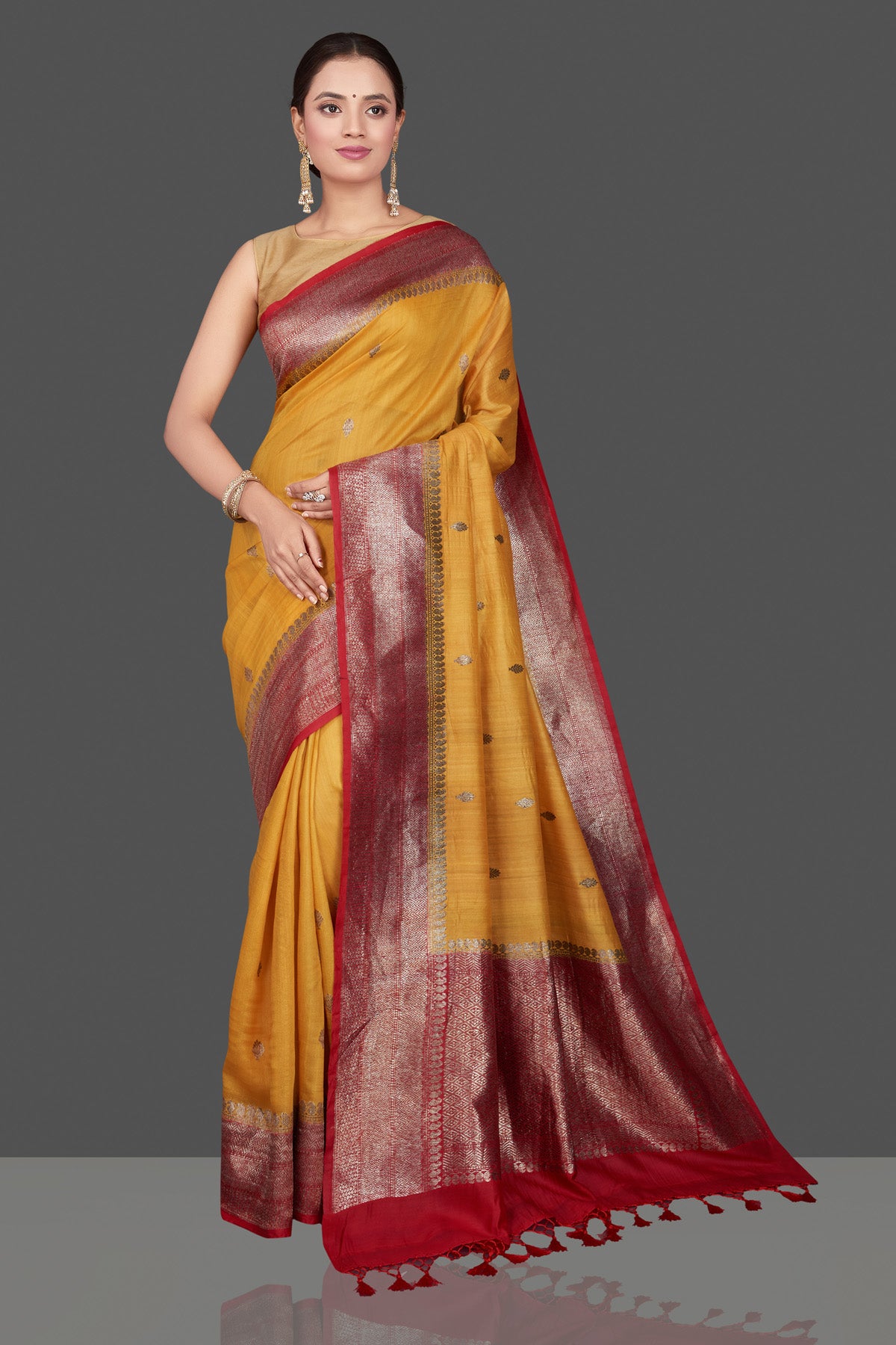 Shop beautiful yellow tussar Banarasi saree online in USA with red zari border. Get ready for festive occasions and weddings in tasteful designer saris, Banarasi sarees, handwoven sarees from Pure Elegance Indian clothing store in USA.-full view