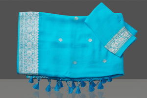 Buy beautiful sky blue chiffon georgette sari online in USA with silver zari border. Go for stunning Indian designer sarees, georgette sarees, handwoven saris, embroidered sarees for festive occasions and weddings from Pure Elegance Indian clothing store in USA.-blouse