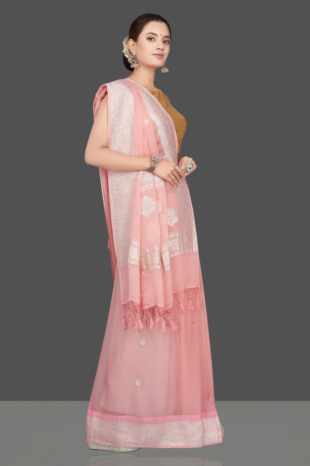 Shop gorgeous light pink chiffon georgette sari online in USA with silver zari border. Go for stunning Indian designer sarees, georgette sarees, handwoven saris, embroidered sarees for festive occasions and weddings from Pure Elegance Indian clothing store in USA.-side