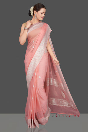 Shop stunning blush pink georgette chiffon sari online in USA with silver zari border. Go for stunning Indian designer sarees, georgette sarees, handwoven saris, embroidered sarees for festive occasions and weddings from Pure Elegance Indian clothing store in USA.-front