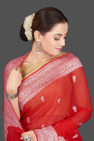 Shop gorgeous red georgette chiffon sari online in USA with silver zari border. Go for stunning Indian designer sarees, georgette sarees, handwoven sarees, embroidered sarees for festive occasions and weddings from Pure Elegance Indian clothing store in USA.-closeup