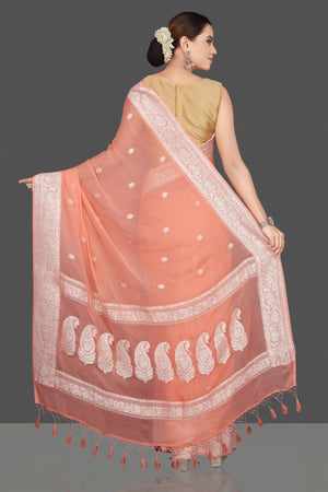 Buy stunning peach color georgette chiffon saree online in USA with silver zari border. Go for stunning Indian designer sarees, georgette sarees, handwoven sarees, embroidered sarees for festive occasions and weddings from Pure Elegance Indian clothing store in USA.-back