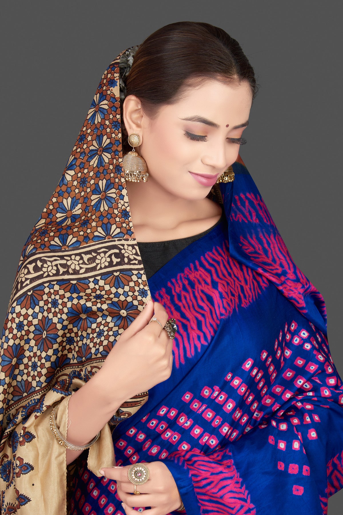 Buy stunning blue and pink gajji silk saree online in USA with ajrakh pallu. Choose from a stunning range of designer sarees, printed sarees, handwoven saris, embroidered sarees for special occasions from Pure Elegance Indian saree store in USA.-closeup
