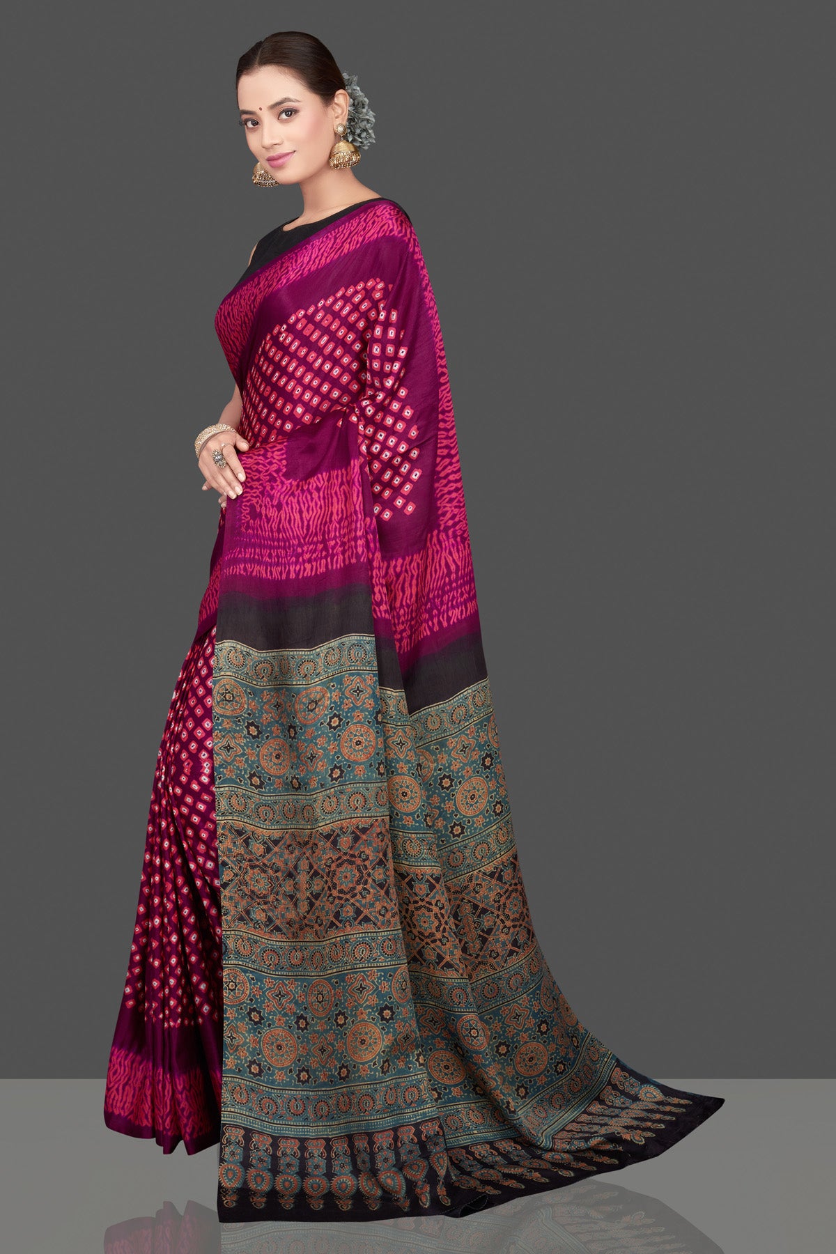 Buy magenta and pink printed gajji silk sari online in USA with Ajrakh pallu. Choose from a stunning range of designer sarees, printed sarees, handwoven saris, embroidered sarees for special occasions from Pure Elegance Indian saree store in USA.-pallu