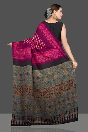 Buy magenta and pink printed gajji silk sari online in USA with Ajrakh pallu. Choose from a stunning range of designer sarees, printed sarees, handwoven saris, embroidered sarees for special occasions from Pure Elegance Indian saree store in USA.-back