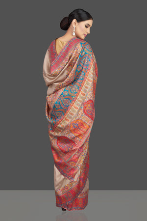 Shop beautiful cream tussar silk sari online in USA with kani embroidery. Look beautiful on weddings and special occasions in stunning Kanchipuram saris, pure silk sarees, handwoven saris from Pure Elegance Indian fashion store in USA.-back
