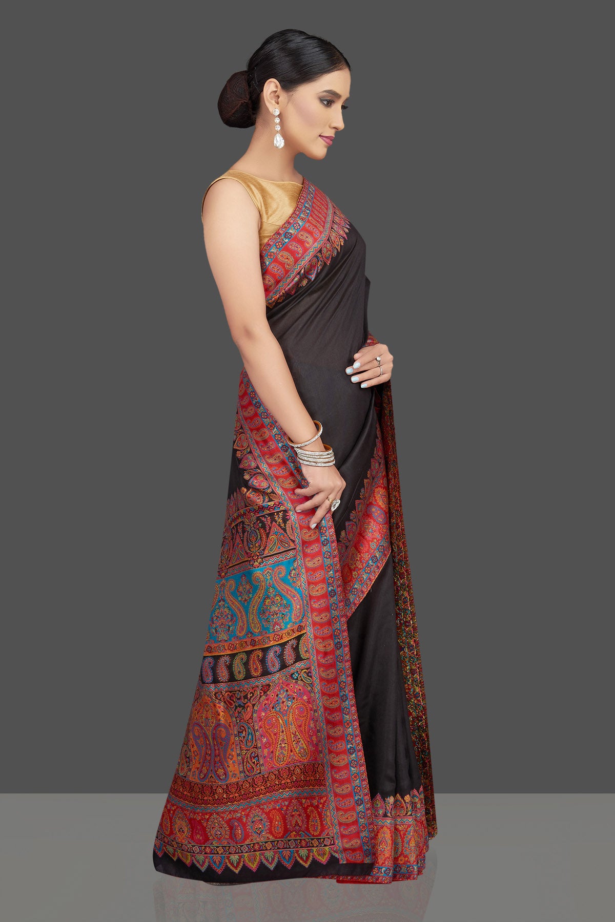 Shop stunning black tussar silk saree online in USA with kani embroidery. Look beautiful on weddings and special occasions in stunning Kanchipuram saris, pure silk sarees, handwoven saris from Pure Elegance Indian fashion store in USA.-side