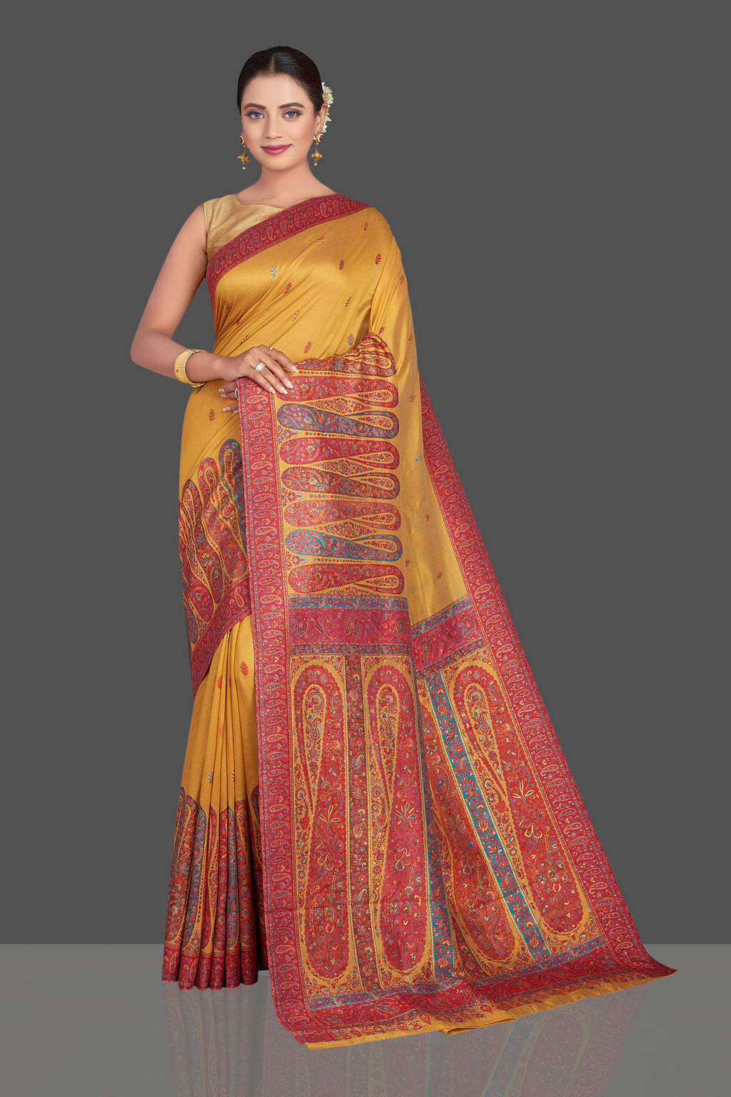 Shop beautiful mustard yellow Kani embroidery tussar silk sari online in USA. Make your presence felt on special occasions in beautiful embroidered sarees, handwoven sarees, pure silk saris, tussar sarees from Pure Elegance Indian saree store in USA.-full view
