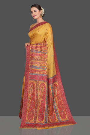 Shop beautiful mustard yellow Kani embroidery tussar silk sari online in USA. Make your presence felt on special occasions in beautiful embroidered sarees, handwoven sarees, pure silk saris, tussar sarees from Pure Elegance Indian saree store in USA.-pallu