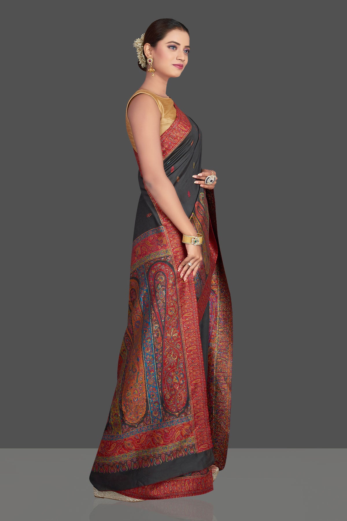 Shop stunning black tussar silk sari online in USA with multicolor Kani embroidery. Make your presence felt on special occasions in beautiful embroidered sarees, handwoven sarees, pure silk saris, tussar sarees from Pure Elegance Indian saree store in USA.-side