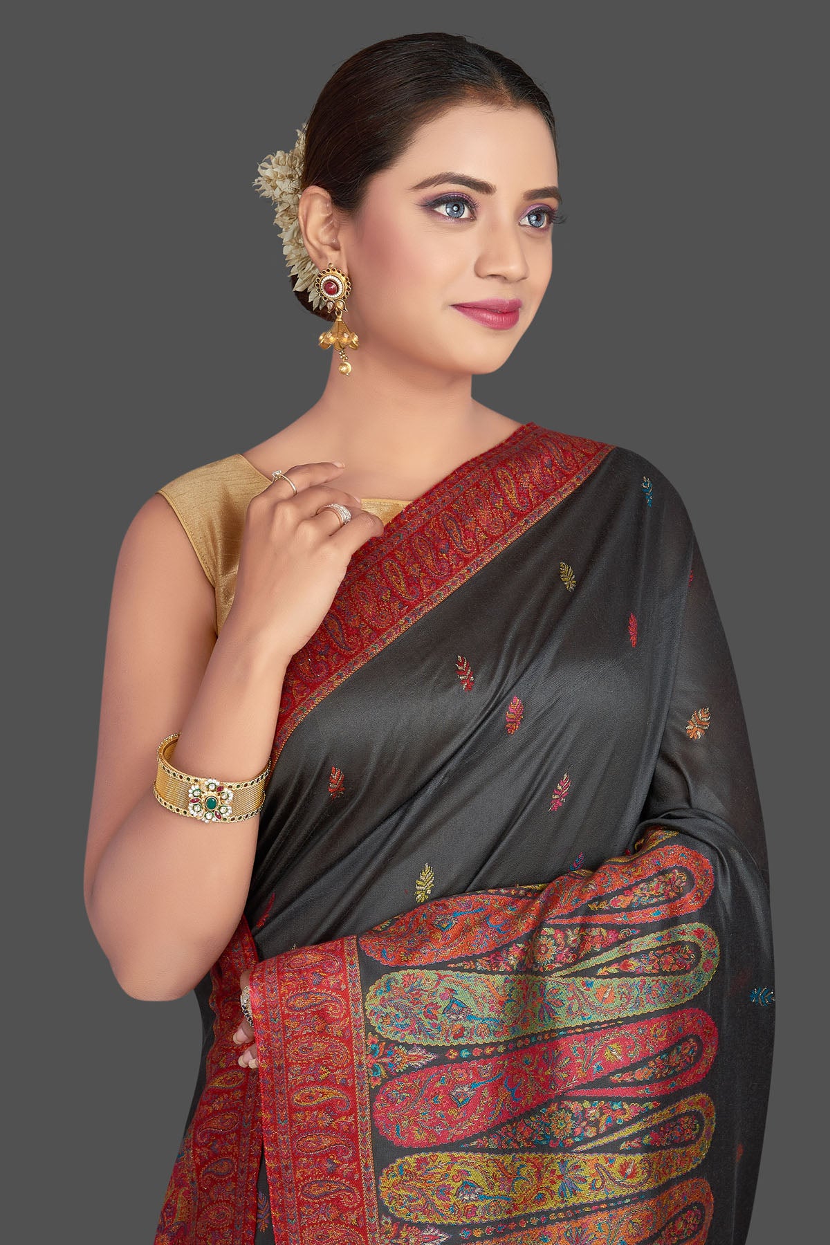 Shop stunning black tussar silk sari online in USA with multicolor Kani embroidery. Make your presence felt on special occasions in beautiful embroidered sarees, handwoven sarees, pure silk saris, tussar sarees from Pure Elegance Indian saree store in USA.-closeup