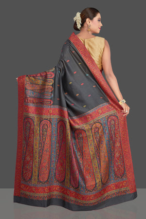 Shop stunning black tussar silk sari online in USA with multicolor Kani embroidery. Make your presence felt on special occasions in beautiful embroidered sarees, handwoven sarees, pure silk saris, tussar sarees from Pure Elegance Indian saree store in USA.-back