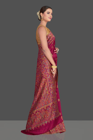 Shop beautiful magenta tussar silk sari online in USA with Kani embroidery. Make your presence felt on special occasions in beautiful embroidered sarees, handwoven sarees, pure silk saris, tussar sarees from Pure Elegance Indian saree store in USA.-side