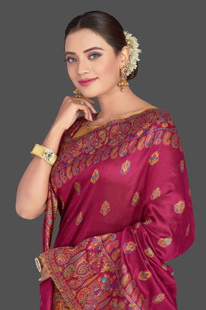 Shop beautiful magenta tussar silk sari online in USA with Kani embroidery. Make your presence felt on special occasions in beautiful embroidered sarees, handwoven sarees, pure silk saris, tussar sarees from Pure Elegance Indian saree store in USA.-closeup