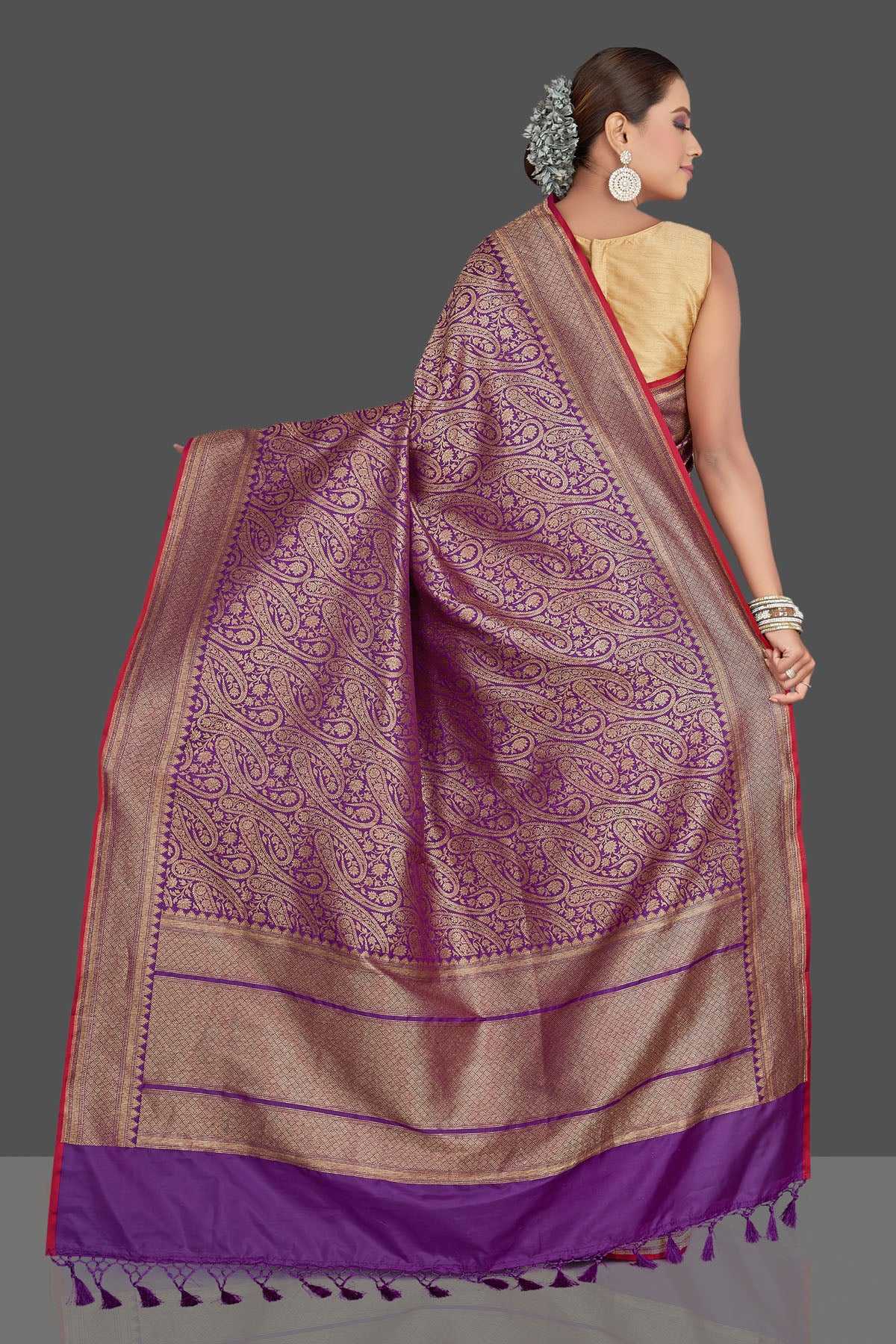 Shop stunning purple tussar Banarasi saree online in USA with overall zari work. Look your best on special occasions with stunning Banarasi sarees, pure silk sarees, tussar saris, handwoven sarees from Pure Elegance Indian saree store in USA.-back