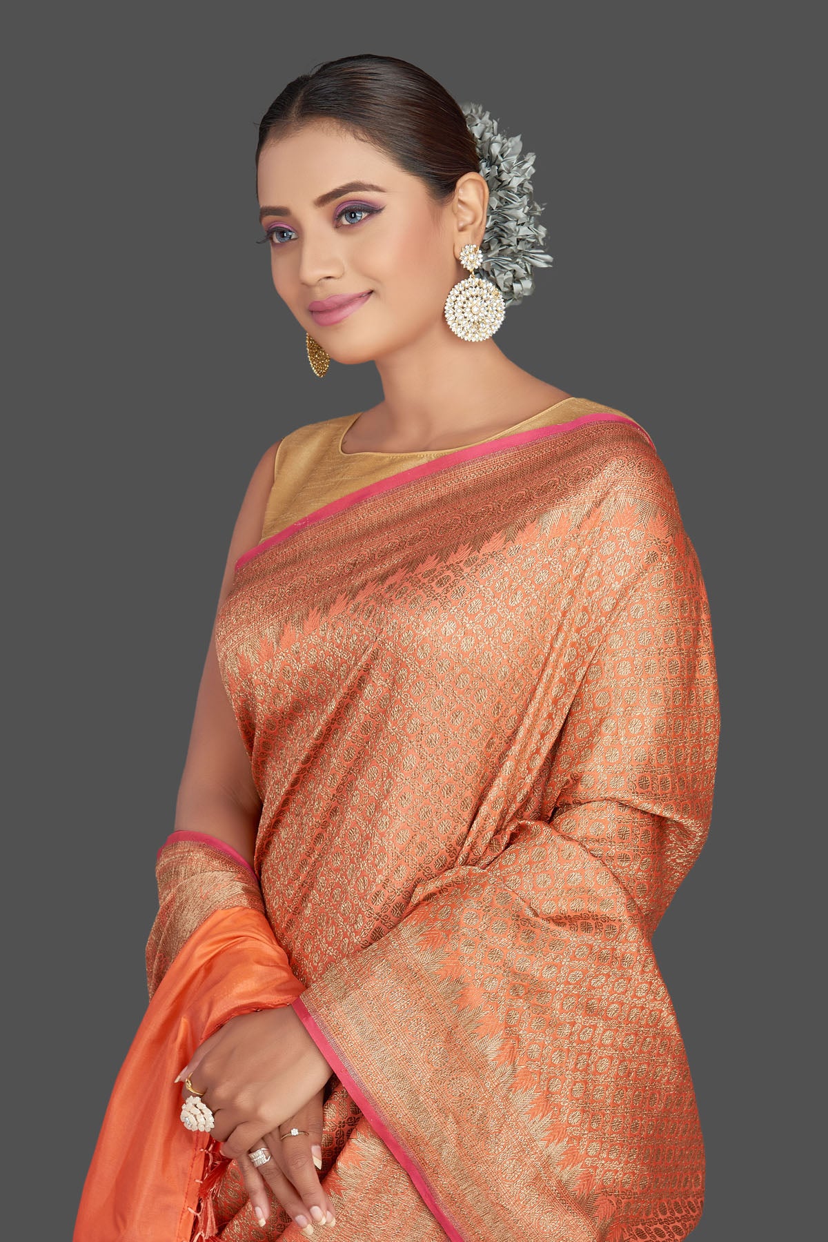 Shop gorgeous orange tussar Banarasi saree online in USA with overall zari work. Look your best on special occasions with stunning Banarasi sarees, pure silk saris, tussar saris, handwoven sarees from Pure Elegance Indian saree store in USA.-closeup