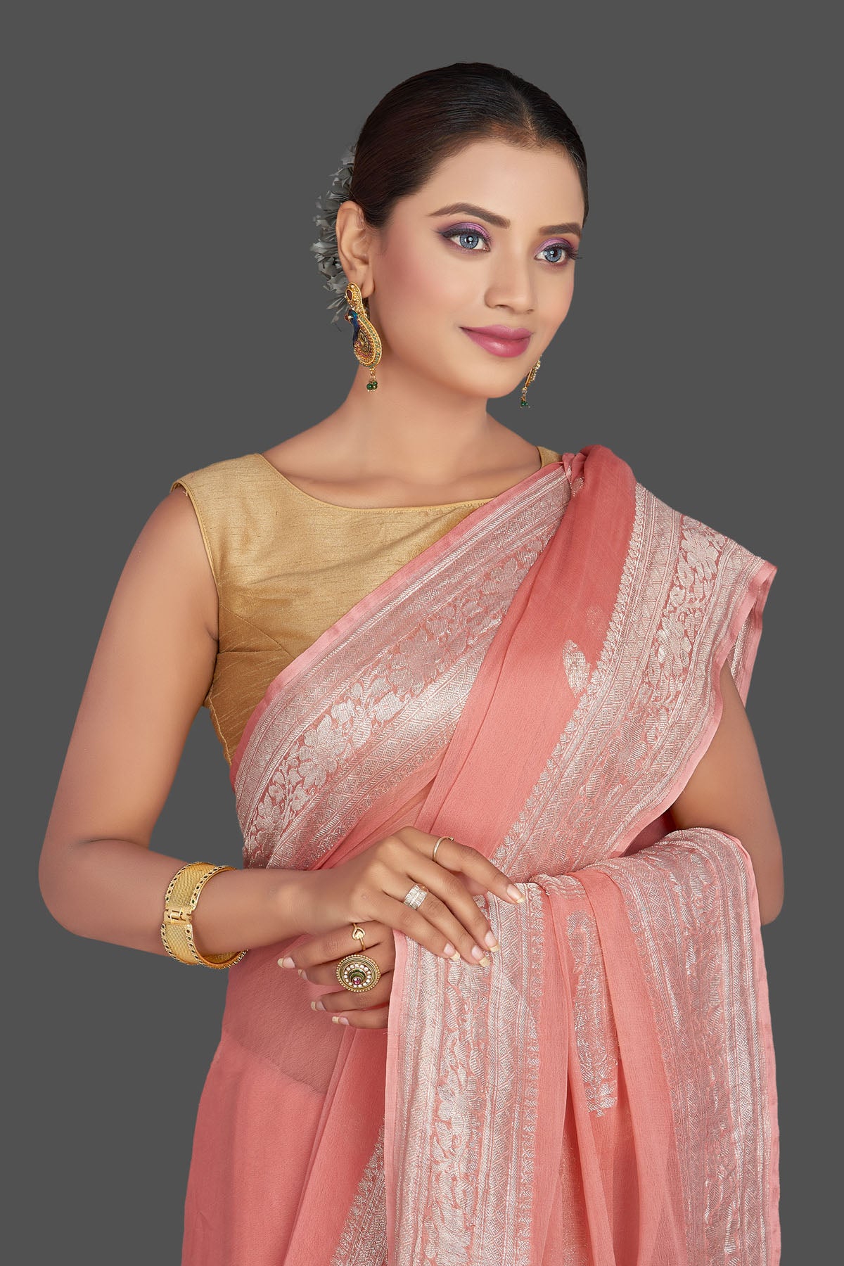 Buy beautiful light pink chiffon georgette saree online in USA with silver zari border. Look your best on special occasions with stunning Banarasi sarees, pure silk saris, tussar saris, handwoven sarees from Pure Elegance Indian saree store in USA.-closeup