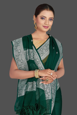 Buy beautiful dark green  chiffon georgette Banarasi sari online in USA with silver zari border. Look your best on special occasions with stunning Banarasi sarees, pure silk saris, tussar saris, handwoven sarees from Pure Elegance Indian saree store in USA.-closeup