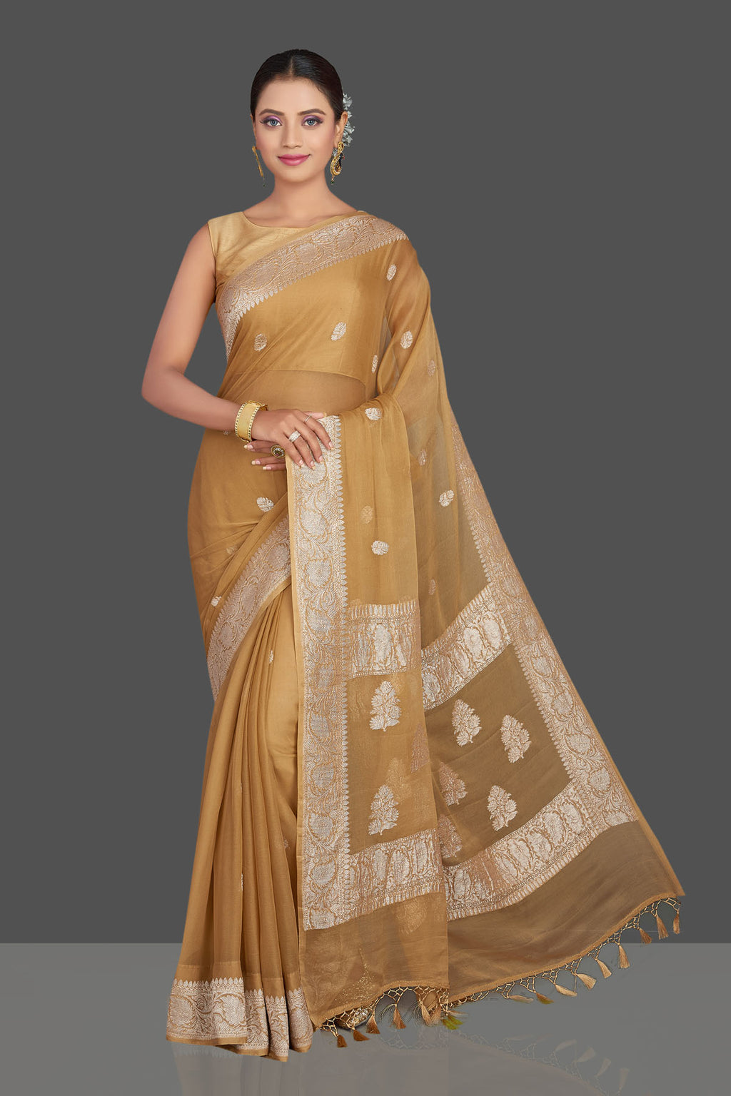 Buy beautiful beige chiffon georgette Banarasi saree online in USA with silver zari border. Look your best on special occasions with stunning Banarasi sarees, pure silk saris, tussar saris, handwoven sarees from Pure Elegance Indian saree store in USA.-full view