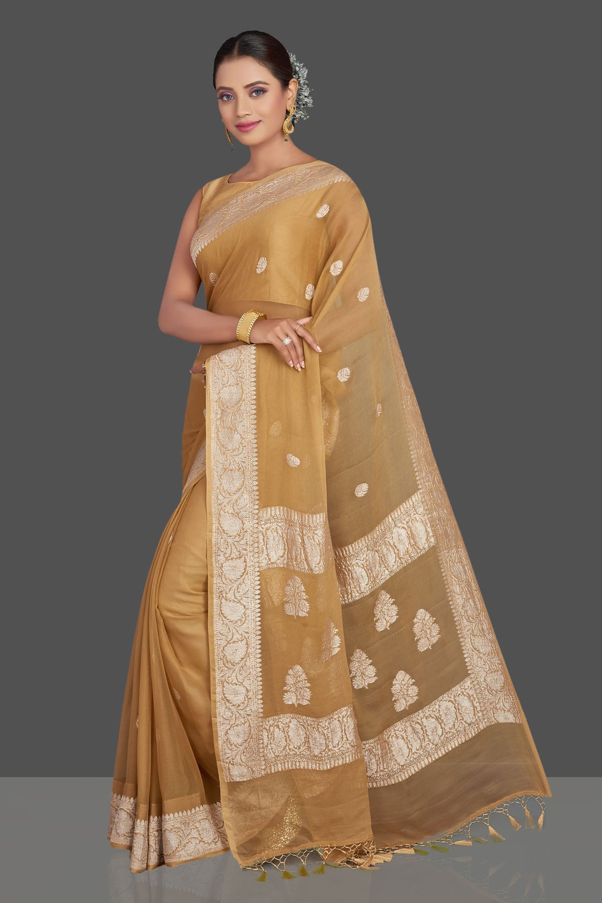 Buy beautiful beige chiffon georgette Banarasi saree online in USA with silver zari border. Look your best on special occasions with stunning Banarasi sarees, pure silk saris, tussar saris, handwoven sarees from Pure Elegance Indian saree store in USA.-pallu