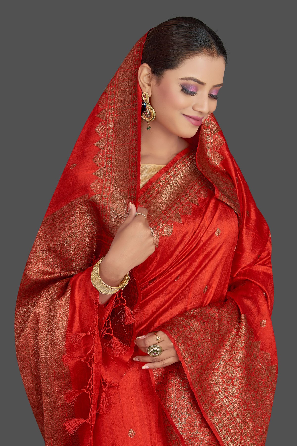 Shop stunning red tussar Banarasi saree online in USA with antique zari border. Look your best on special occasions with stunning Banarasi saris, pure silk saris, tussar sarees, handwoven sarees from Pure Elegance Indian saree store in USA.-closeup