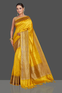 Shop gorgeous yellow tussar Banarasi saree online in USA with antique zari border. Look your best on special occasions with stunning Banarasi saris, pure silk saris, tussar sarees, handwoven sarees from Pure Elegance Indian saree store in USA.-full view